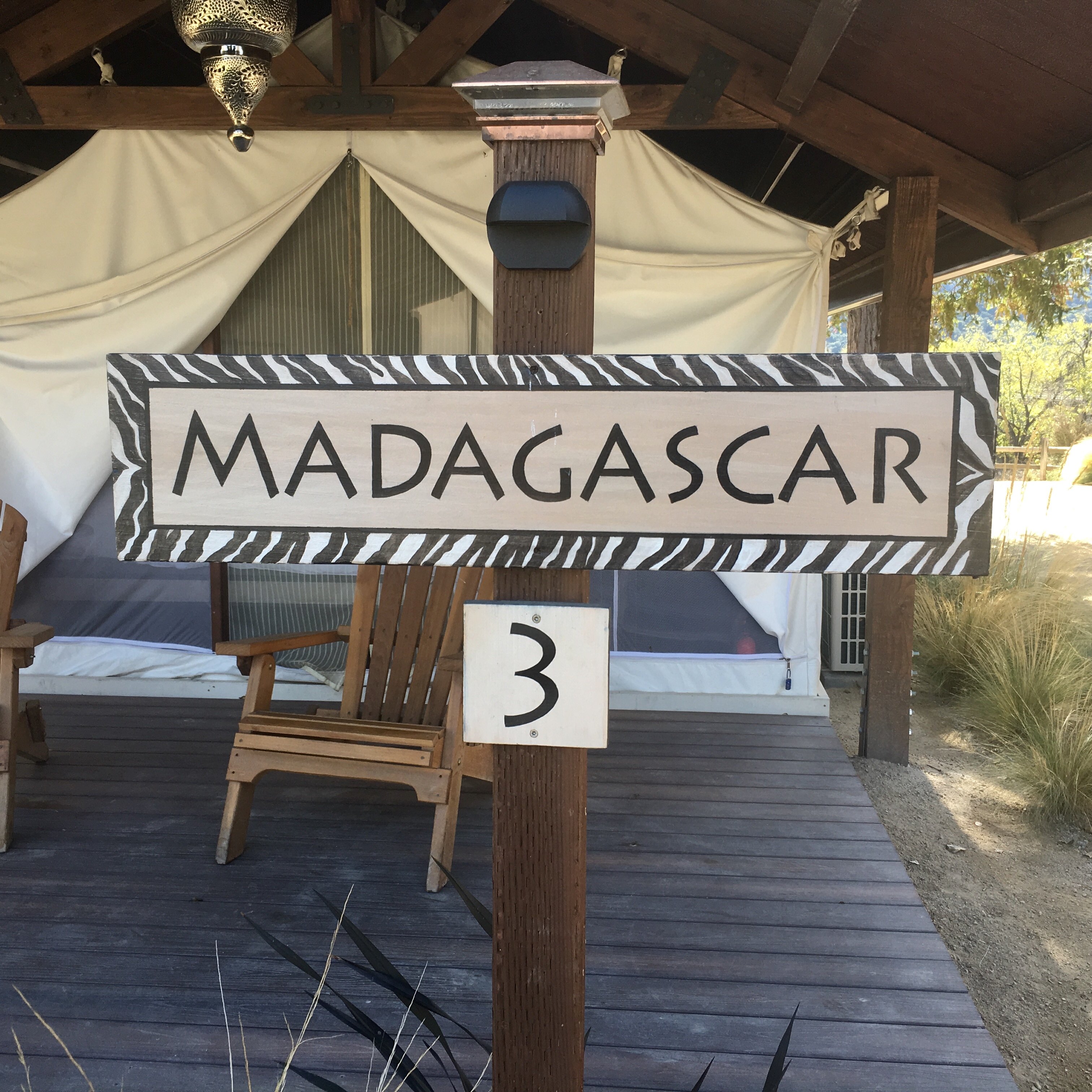 Safari Village sign in front of safari tent